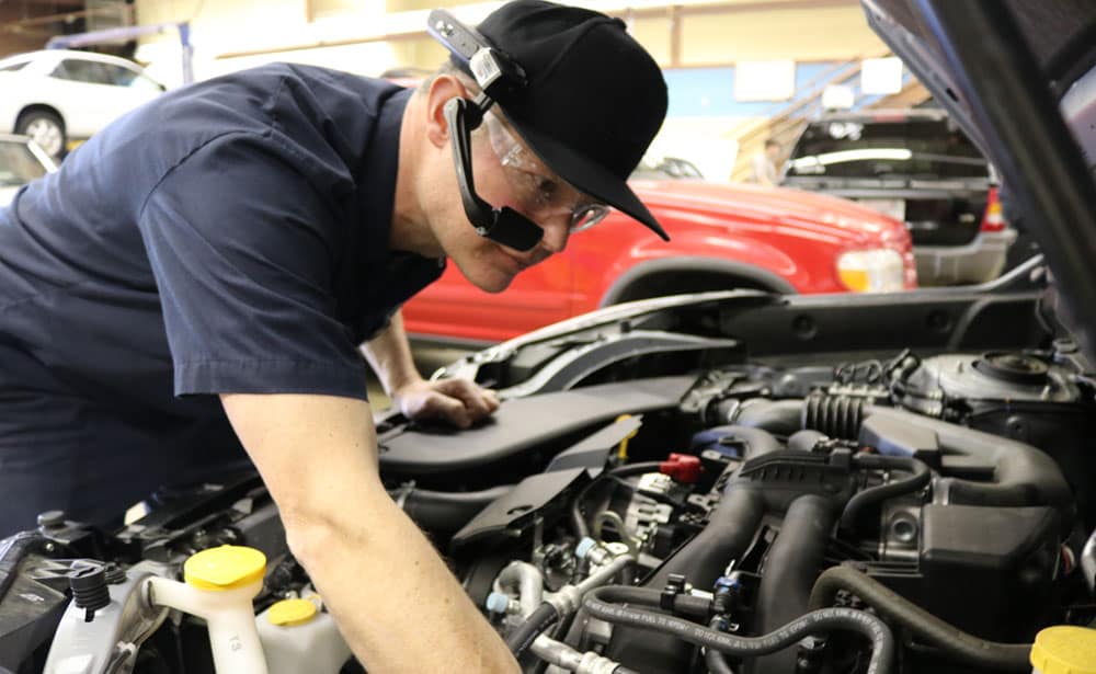 How Tethr It Extends Careers of Technicians 1 Auto Technician Working on Vehicle Engine